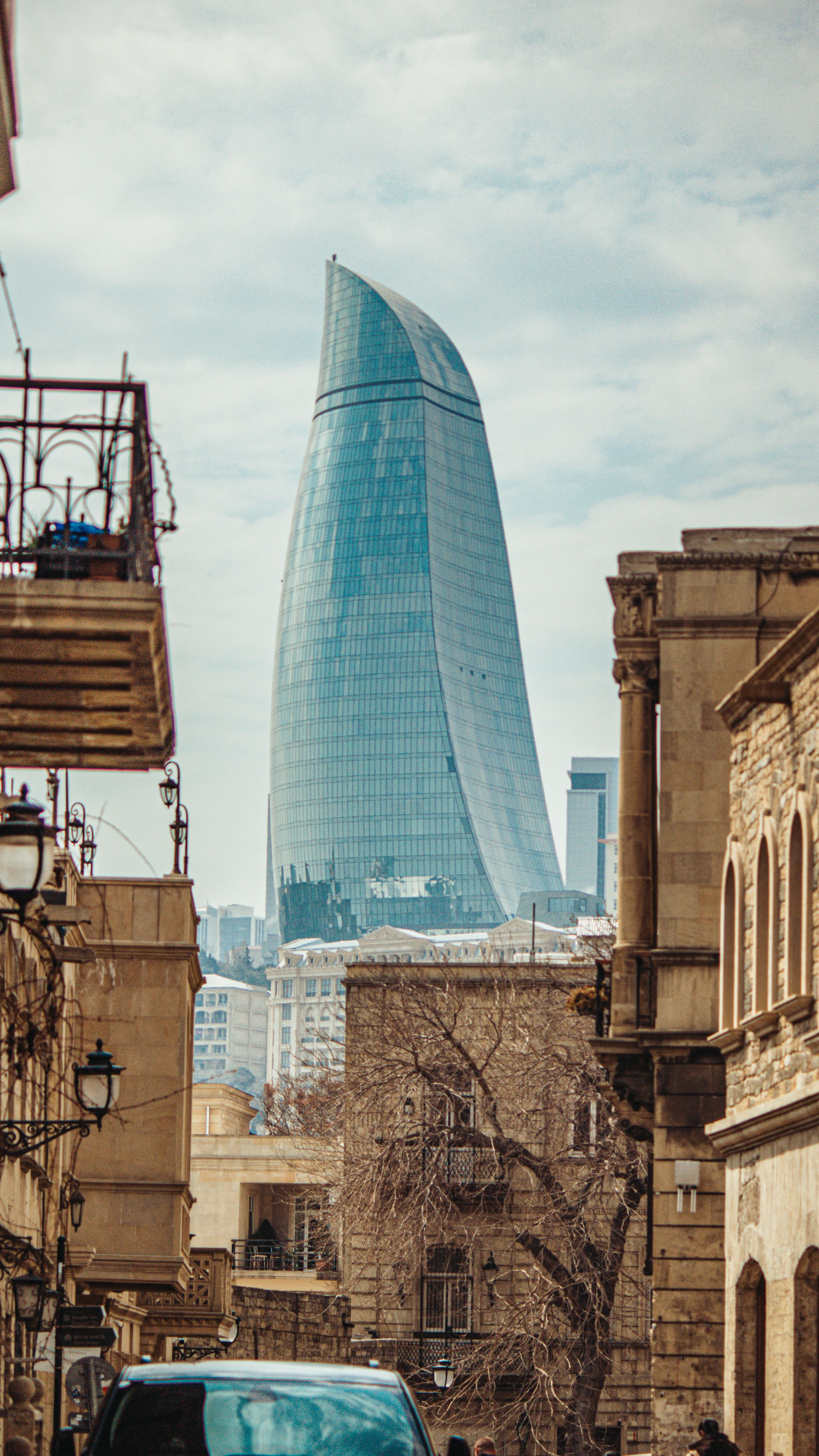 View of the iconic Flame Towers rising above the historic streets of Baku, Azerbaijan.