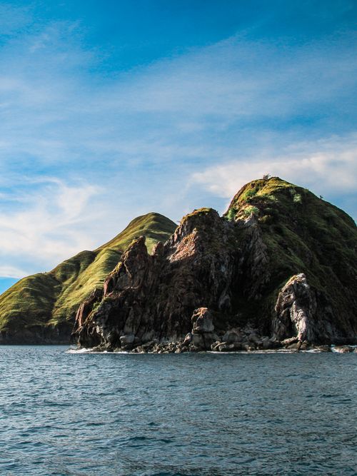 Free Explore the rugged beauty of these eroded coastal rock formations against a bright blue sky. Stock Photo