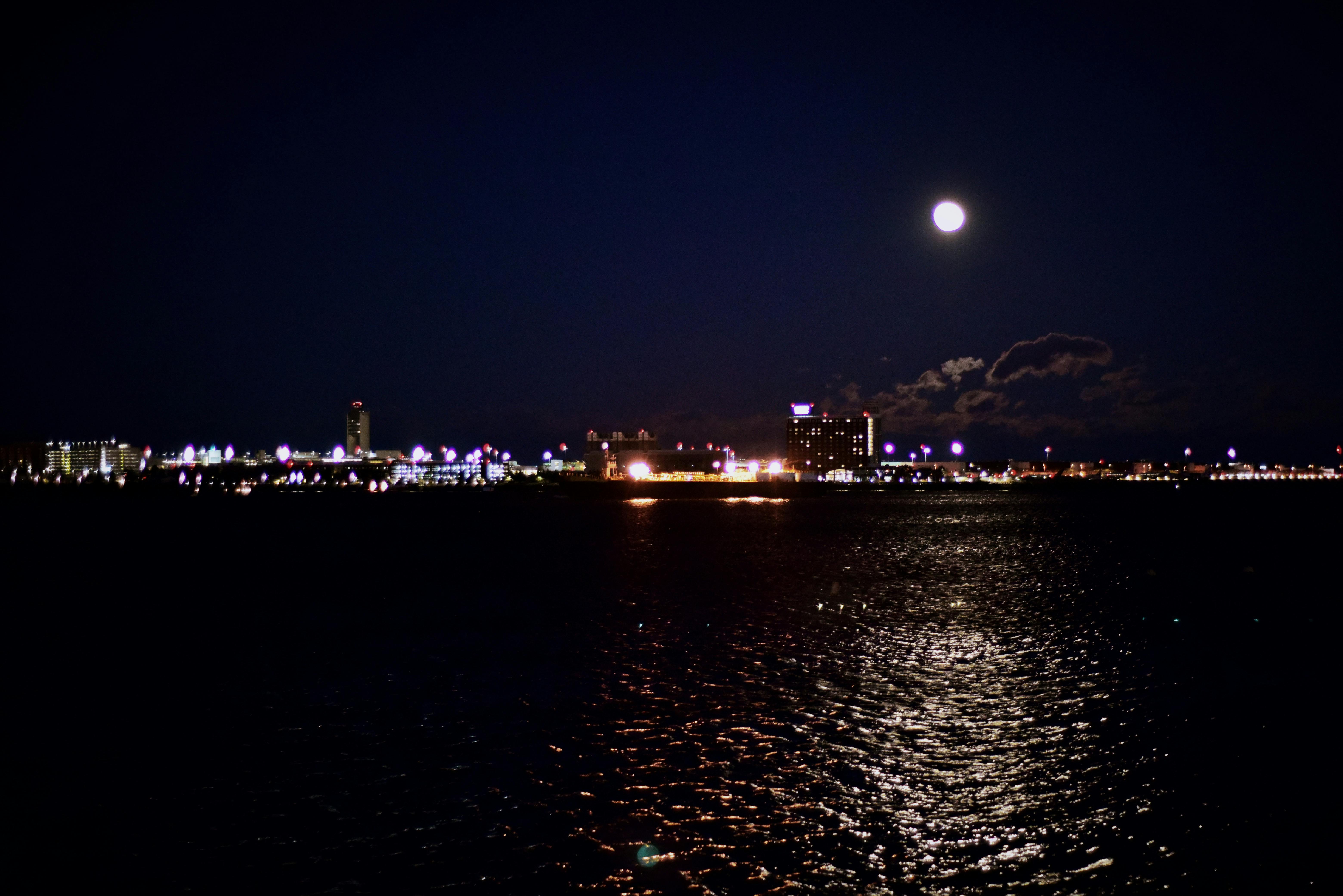 Free stock photo of full moon, moon on the sea, night city