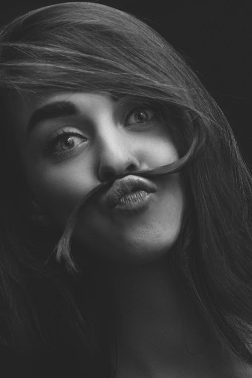 Woman Posing with Hair over Mouth