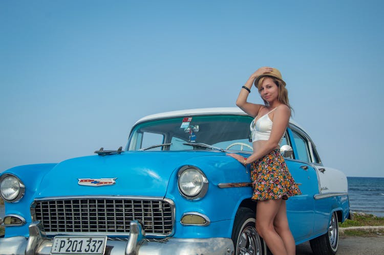 Woman Posing By Blue Chevrolet Bel Air