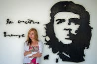 Woman Posing by Che Guevara Mural