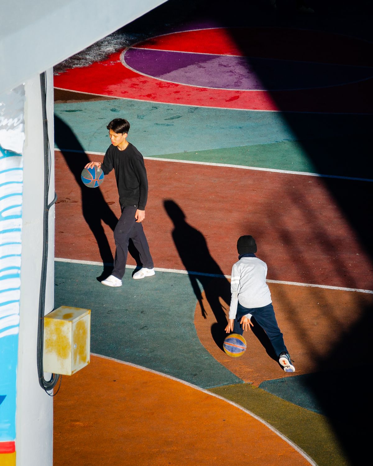 Teenagers taking part in a purposeful basketball practice session
