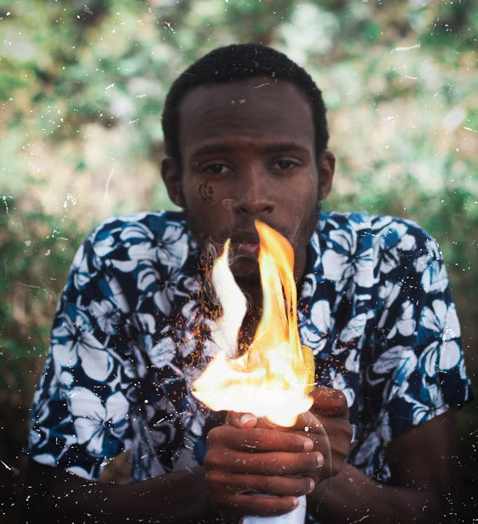 Free stock photo of african boy, blue shirt, fire Stock Photo