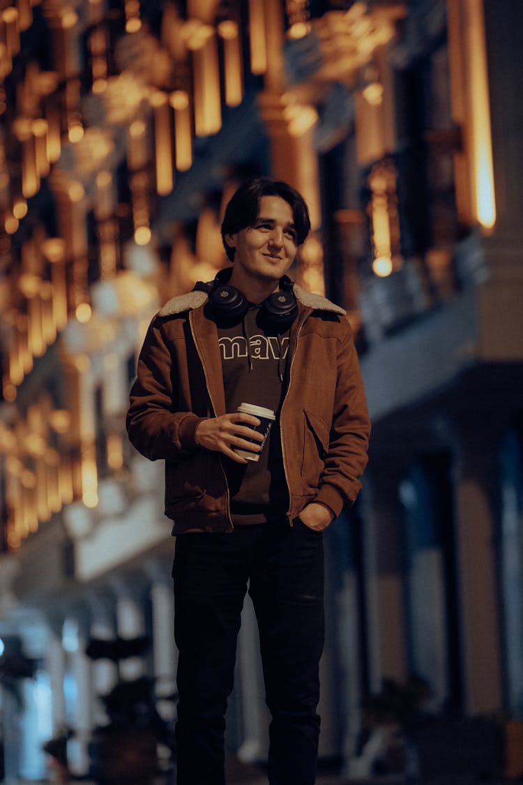 Smiling Man Posing In Jacket At Night