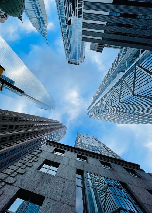 Free Dramatic upward view of skyscrapers in downtown Philadelphia against a vibrant sky. Stock Photo
