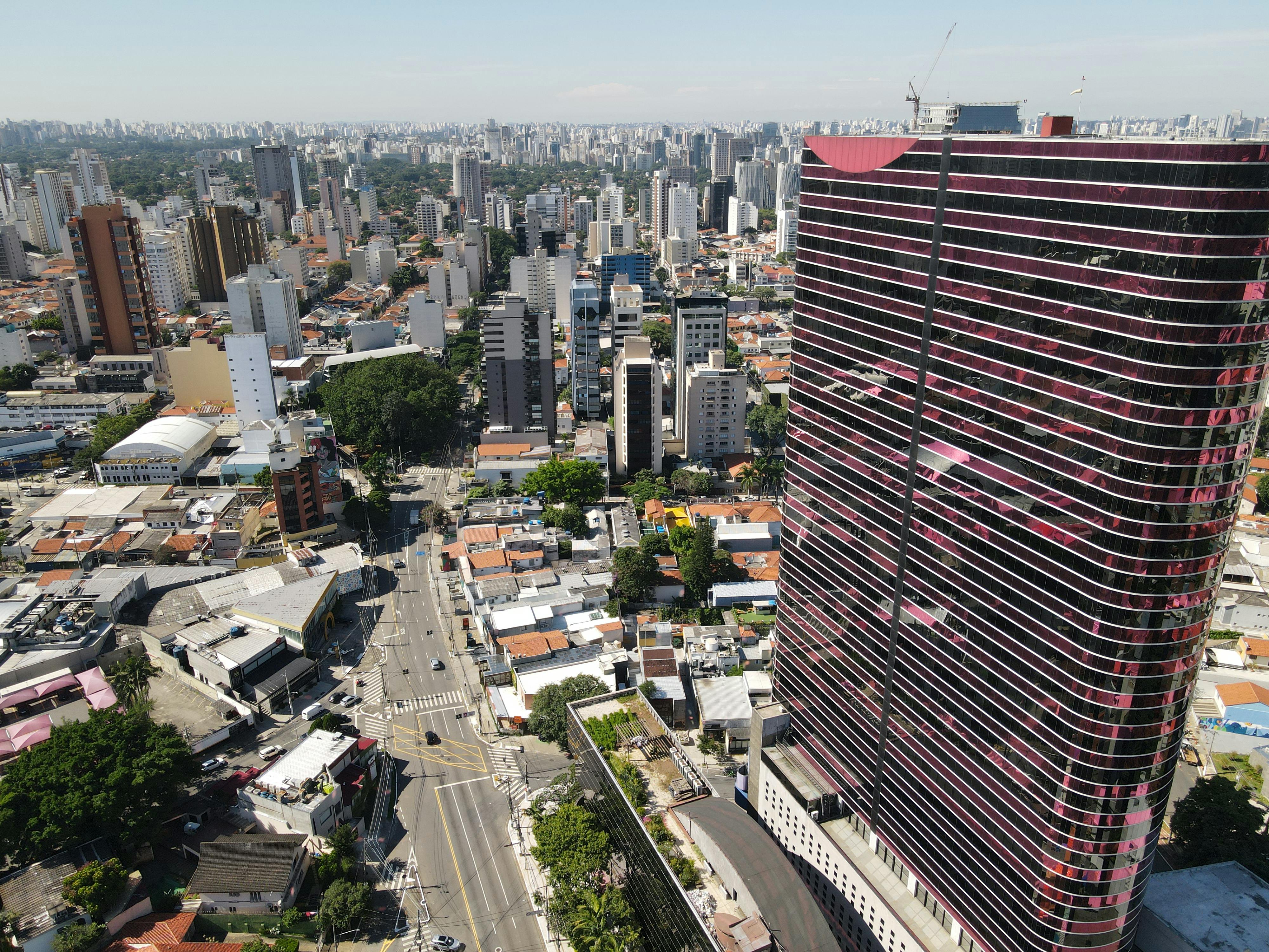 A stunning aerial view showcasing the vibrant cityscape of São Paulo, focusing on the Instituto Tomie Ohtake.