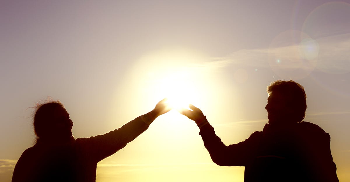 Hopeful Couple Looking At A Sunset
