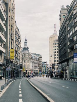 Street view of Bucharest showcasing historic architecture and urban life.