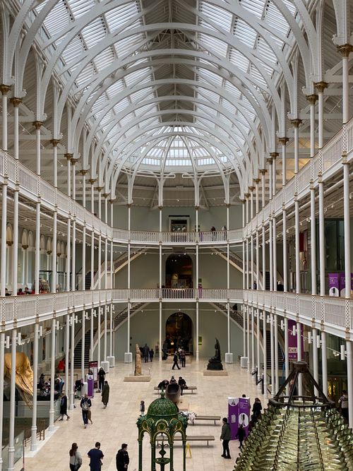 Free Explore the grand architectural design of the National Museum of Scotland's interior, featuring a glass ceiling and mezzanines. Stock Photo