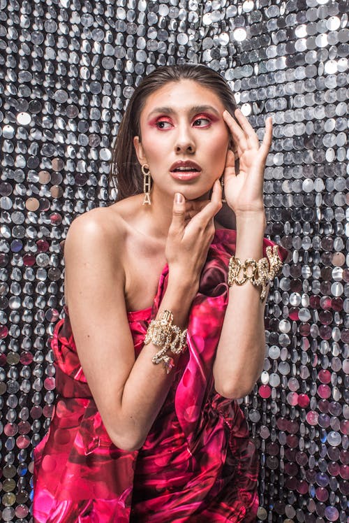 Young Woman in a Pink Dress and Jewelry 