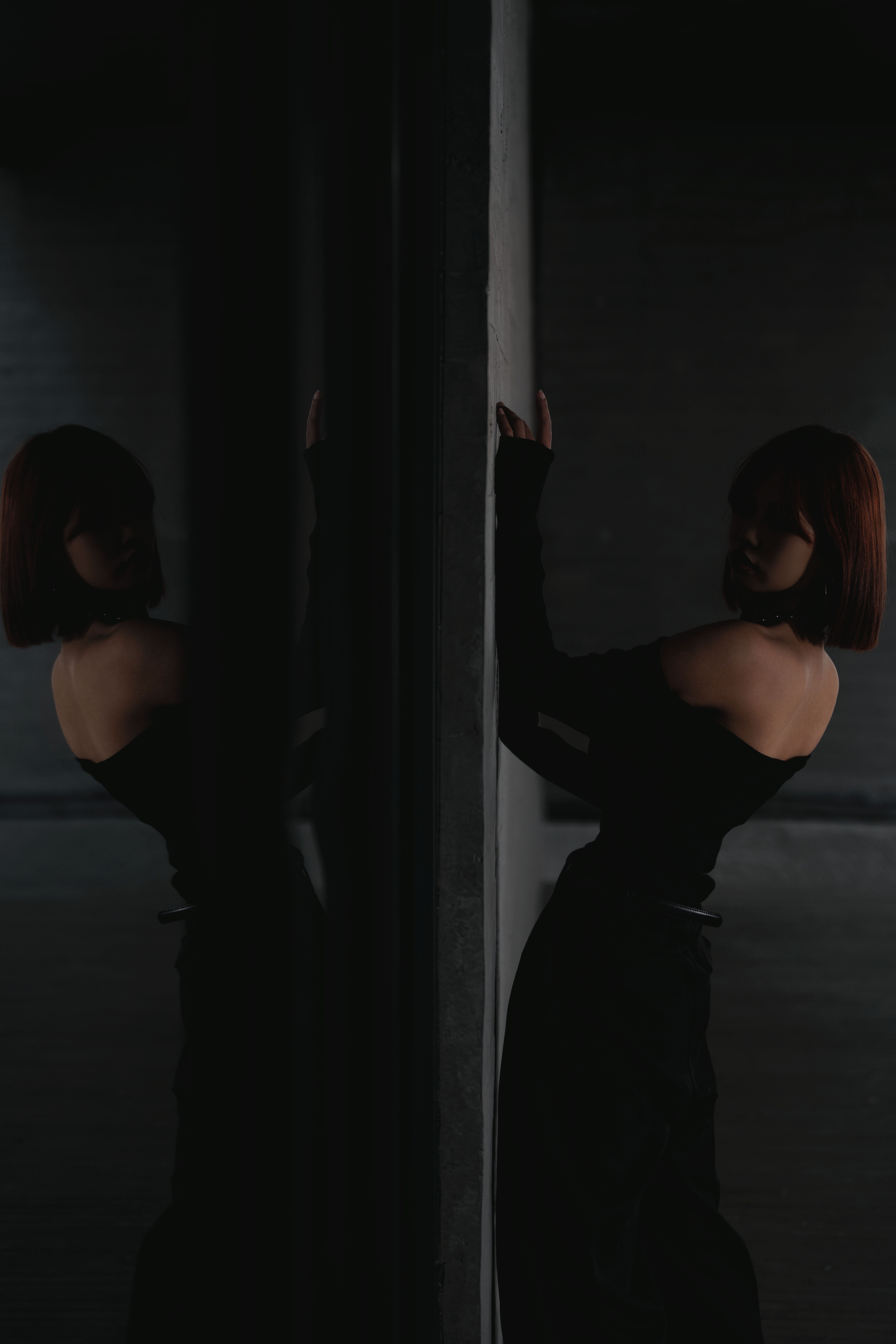 Woman in Evening Black Dress Posing in Darkness · Free Stock Photo