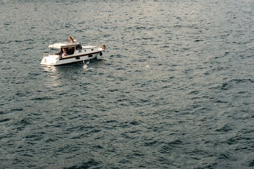 Free A motorboat sailing in the Bosphorus sea near Istanbul, Turkey under a clear sky. Stock Photo