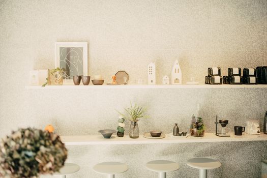 Artistic display of modern decor items in a minimalist retail space with soft lighting.