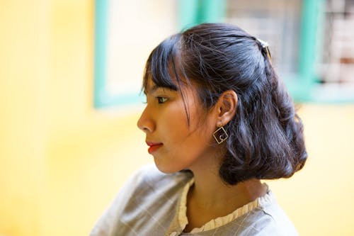 Free Close-Up Photo of Woman Wearing Earring Stock Photo