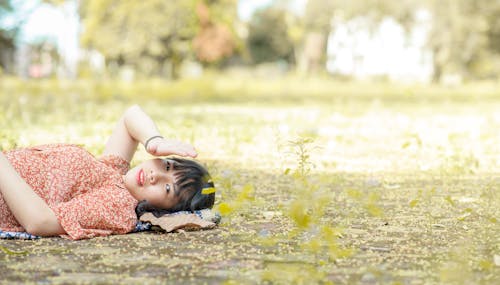 Photo of Woman Laying On Ground