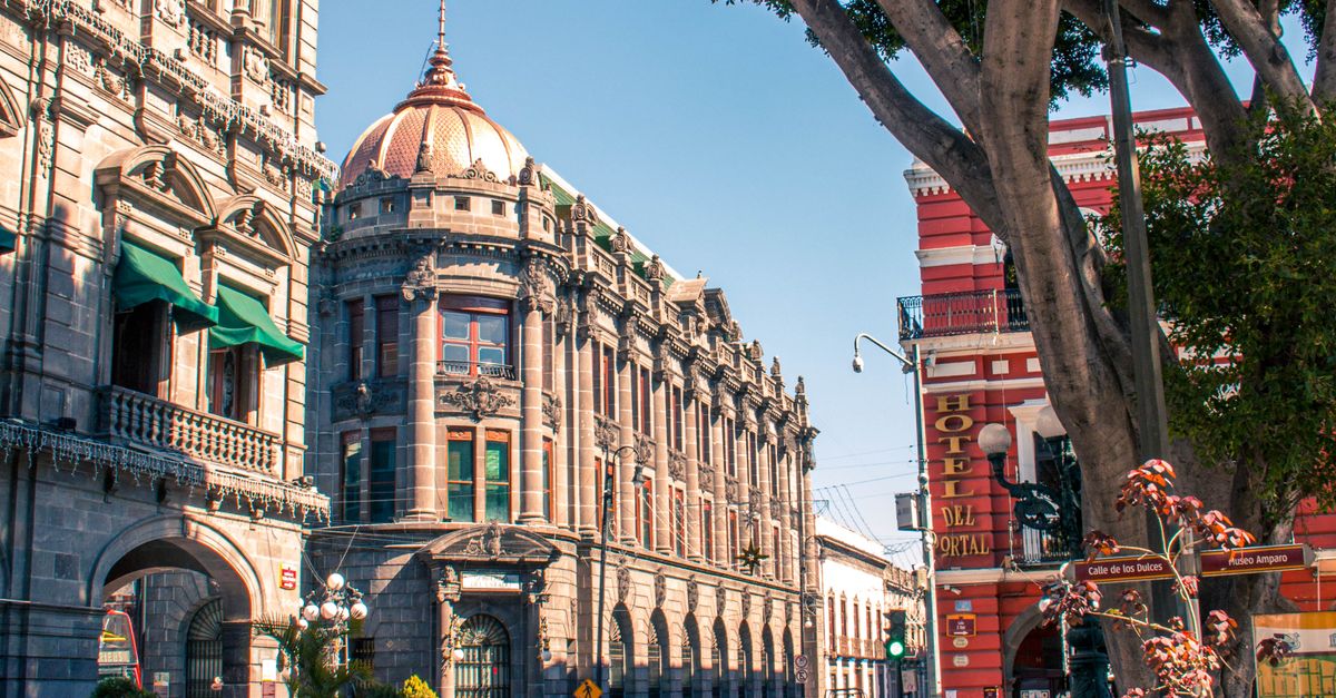 Street view of historic Puebla architecture in a vibrant cityscape.