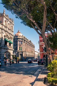 Street view of historic Puebla architecture in a vibrant cityscape.