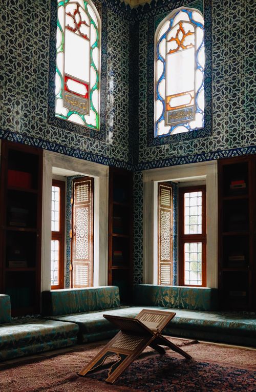 Free Elegant Ottoman-style room with vibrant stained glass windows in Topkapi Palace Museum, Istanbul. Stock Photo