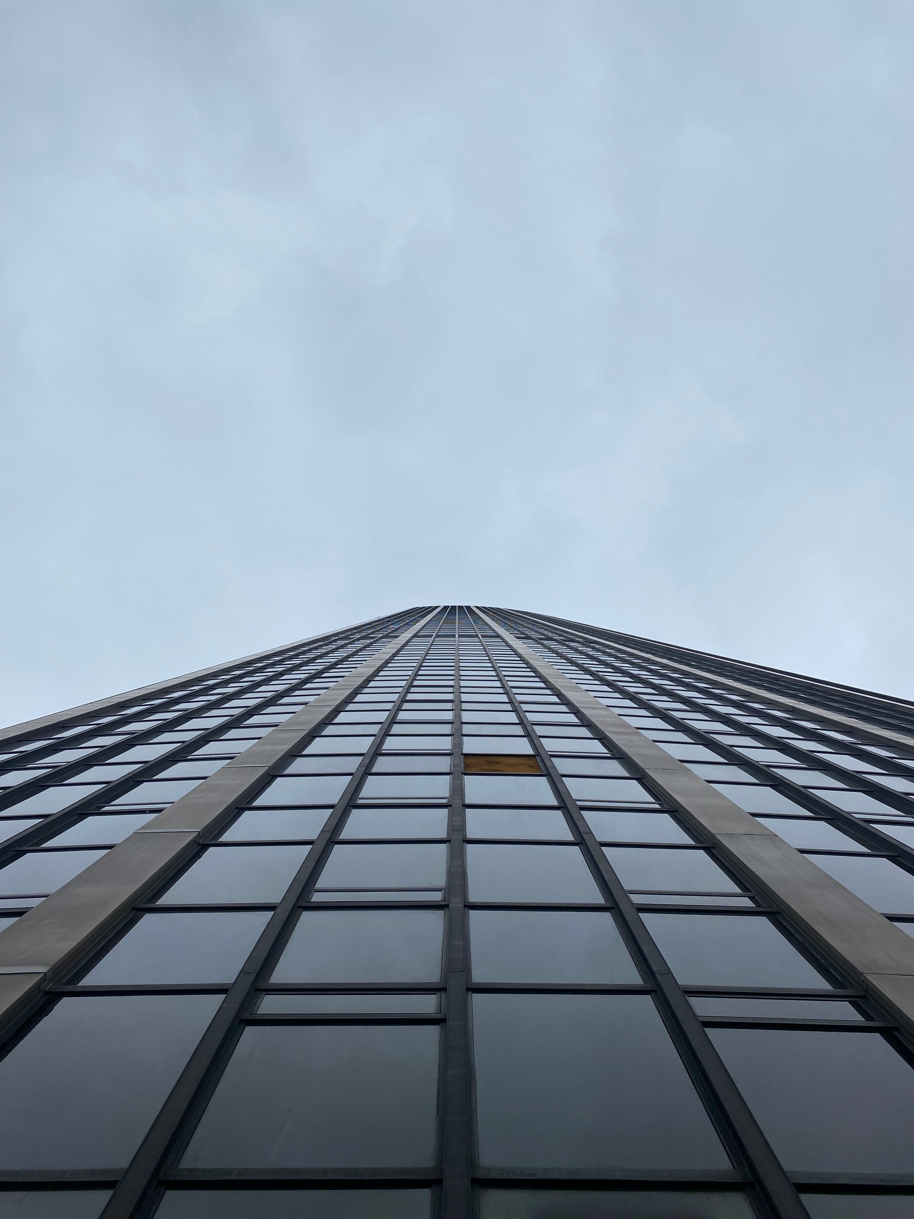 Low Angle Shot of a Facade of a Skyscraper · Free Stock Photo