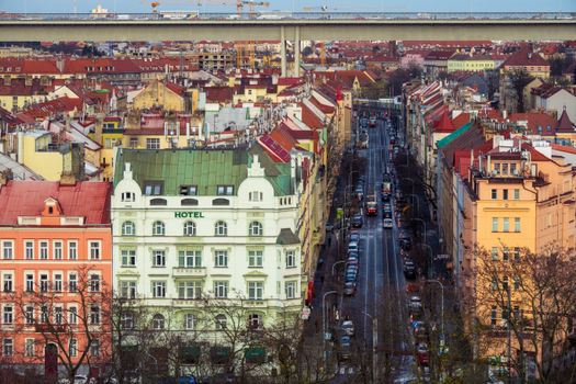 Aerial shot of colorful buildings and streets in Prague, showcasing urban architecture.