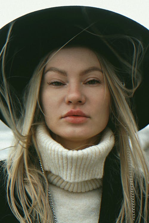 Model in Hat and Turtleneck Sweater