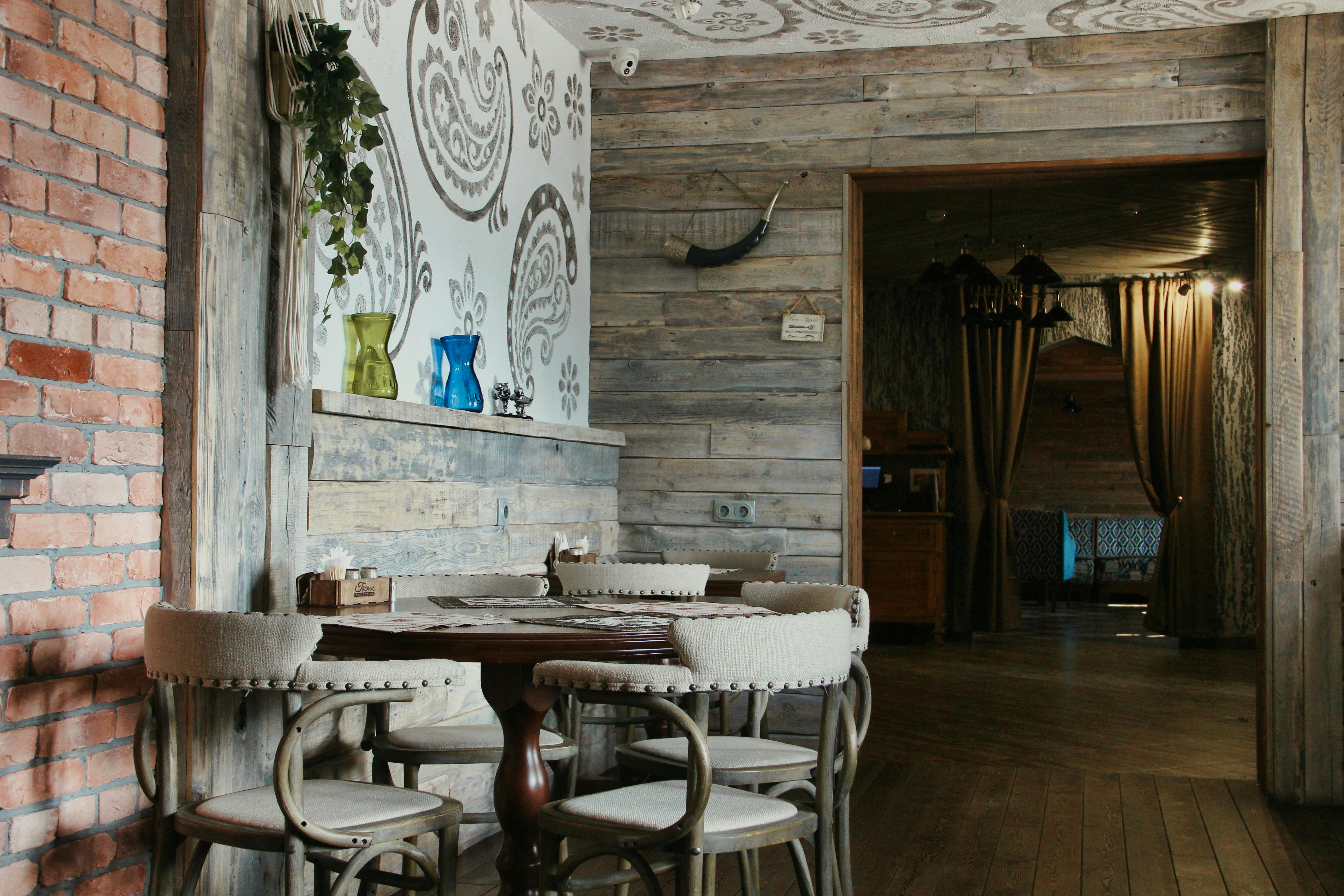 a restaurant with wooden walls and tables