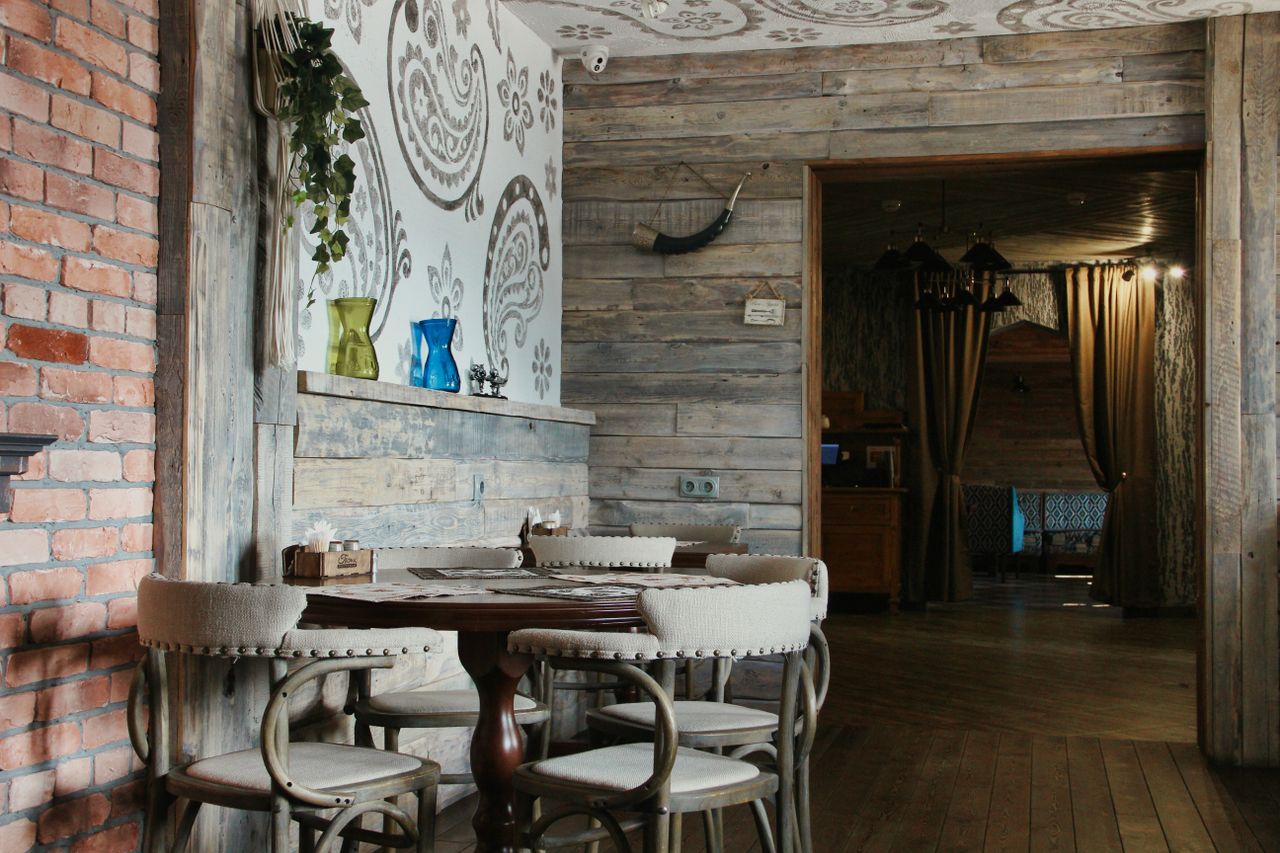 cozy rustic restaurant scene with wooden decor and cozy seating