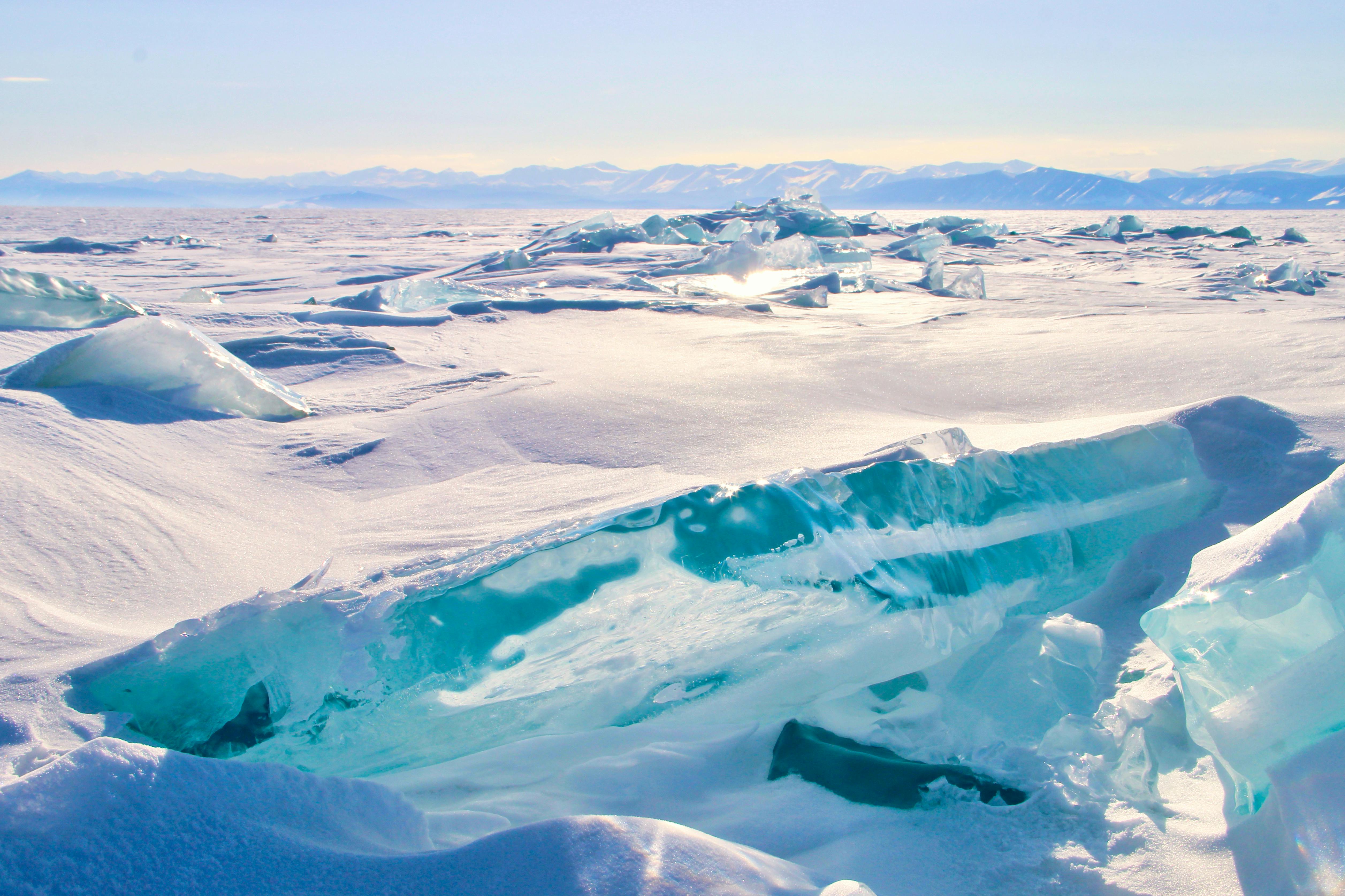 a large body of water with ice and snow