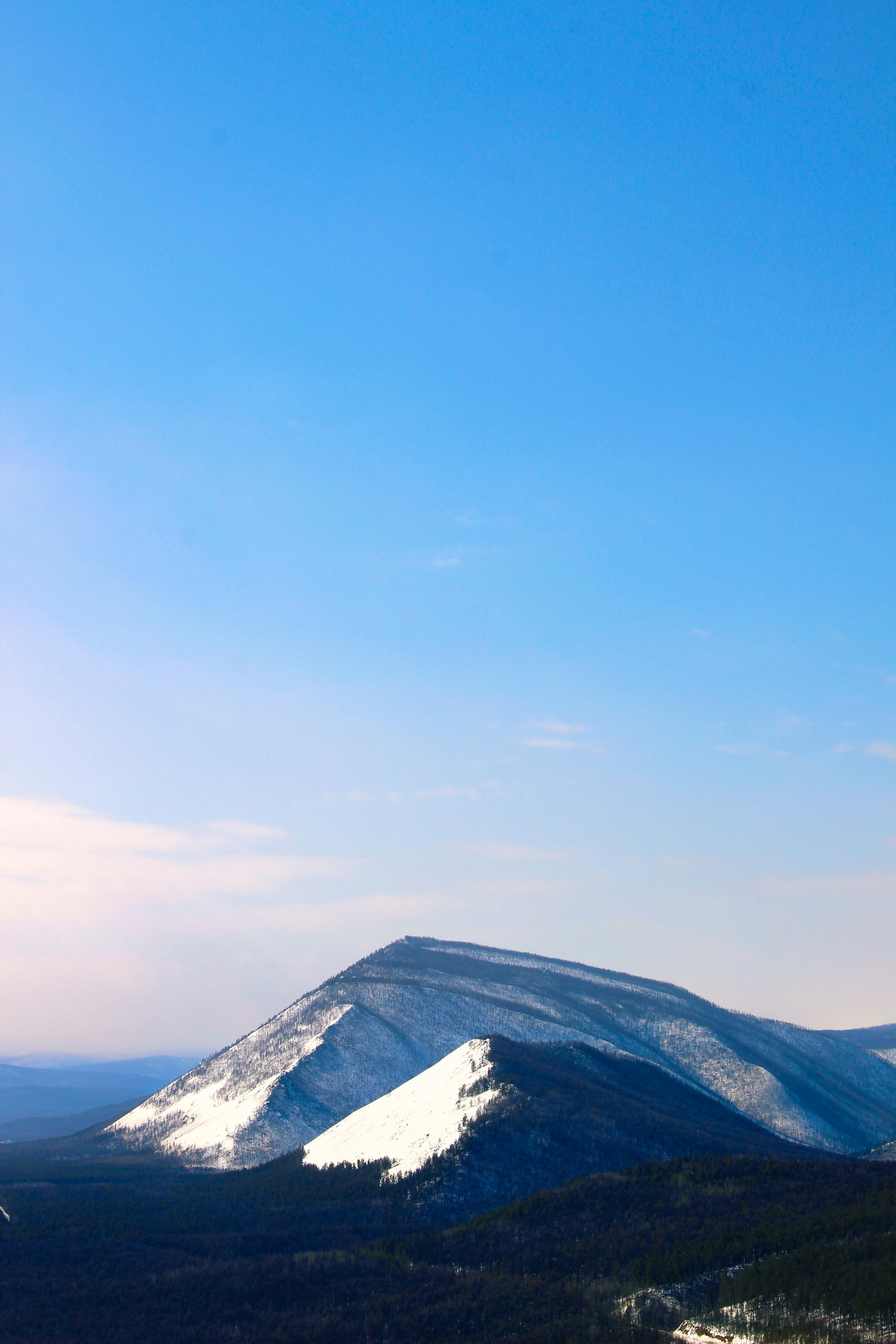 a view of a mountain with snow on it