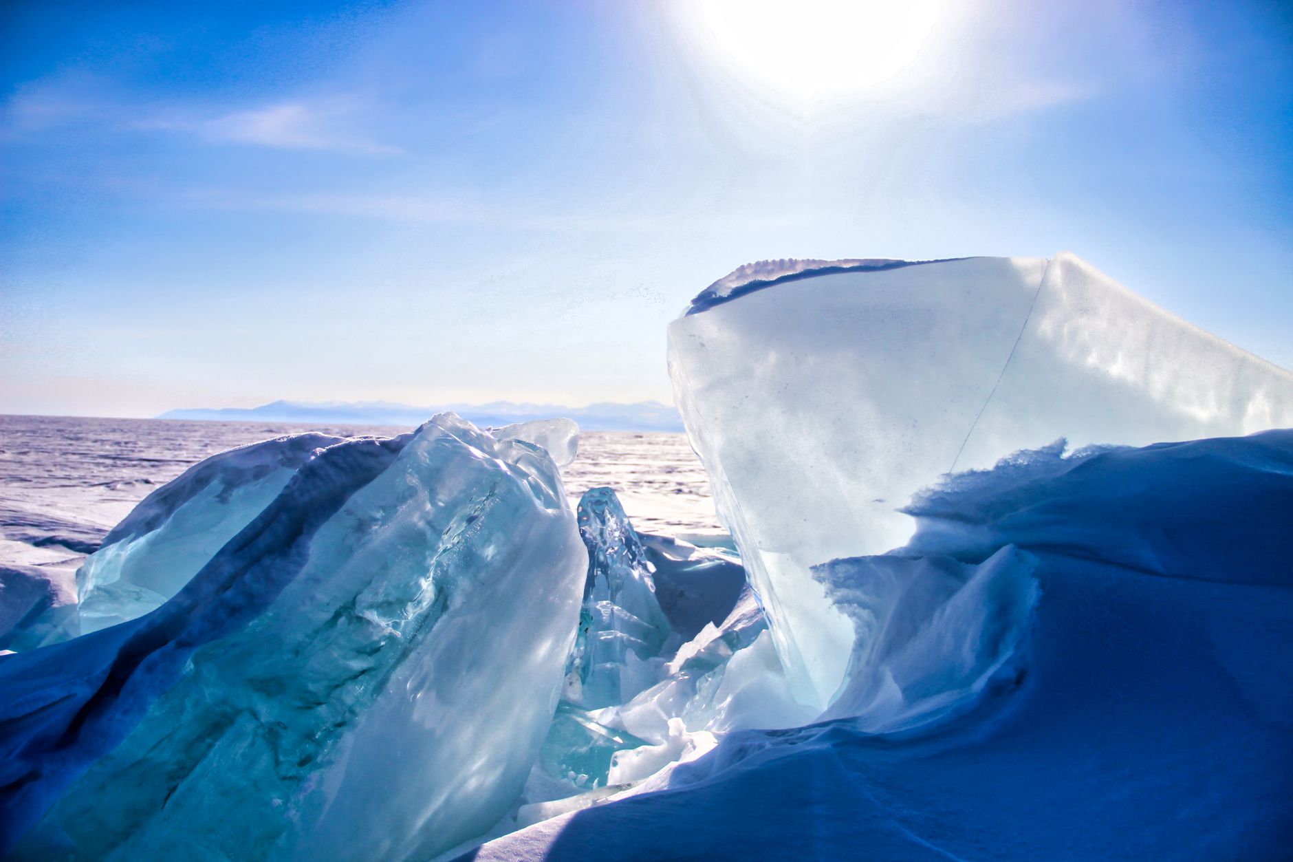 Majestic icebergs glistening in sunlight, capturing the beauty of winter's frozen landscape.