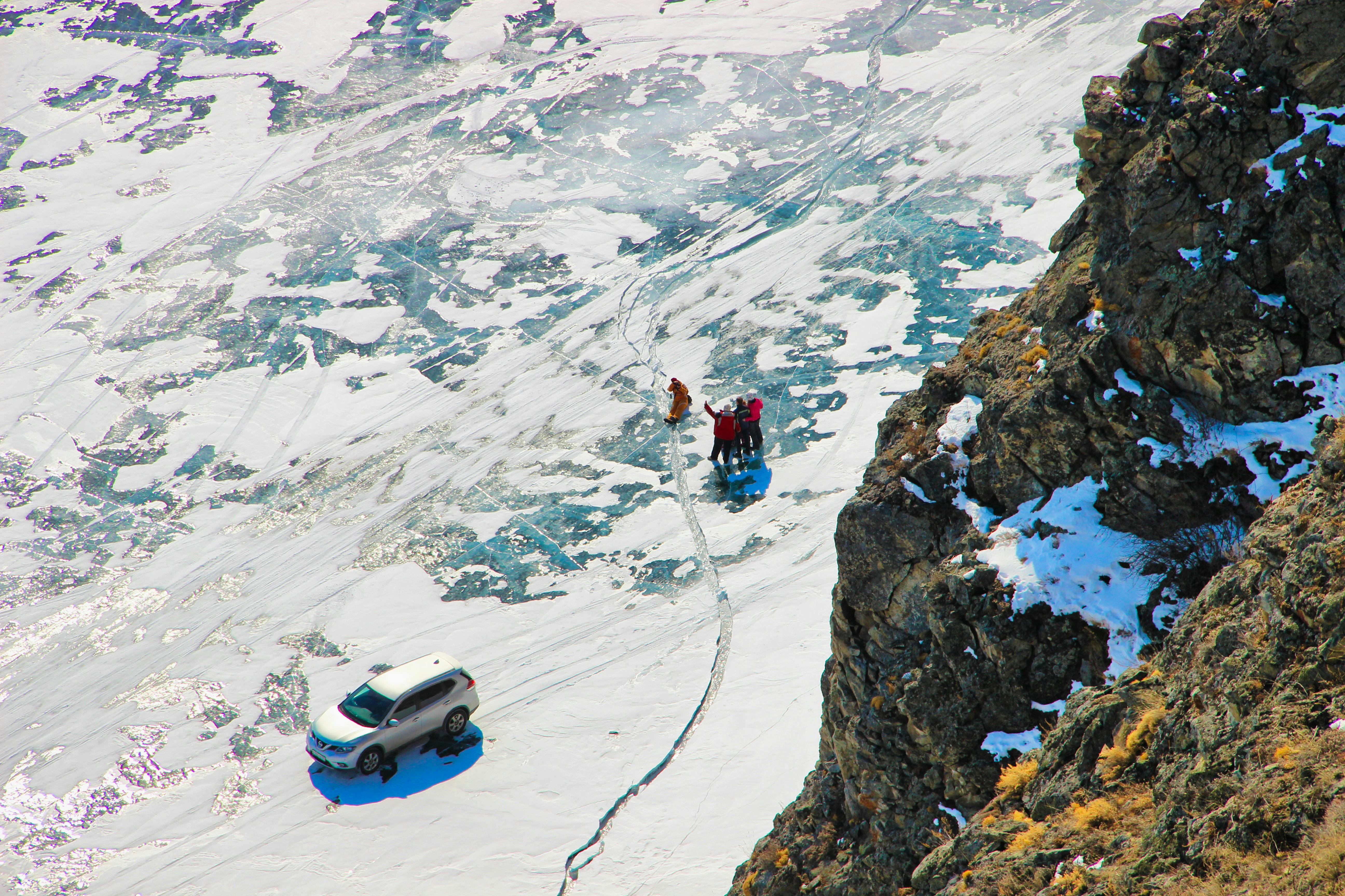 a car is parked on a snowy mountain