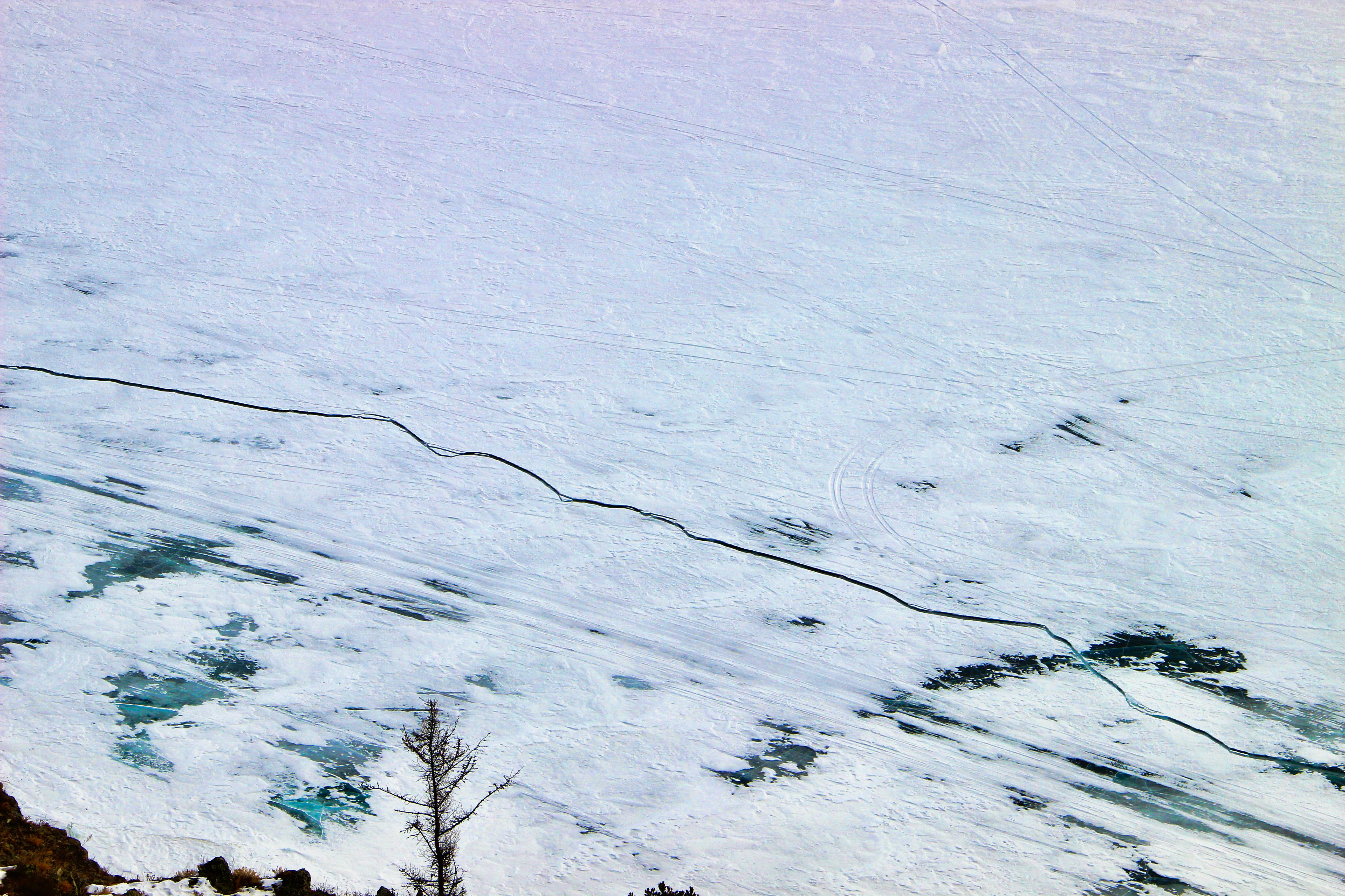 a person walking on a snowy hillside