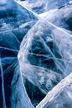 Stunning close-up of intricate blue ice formations showcasing winter's beauty.