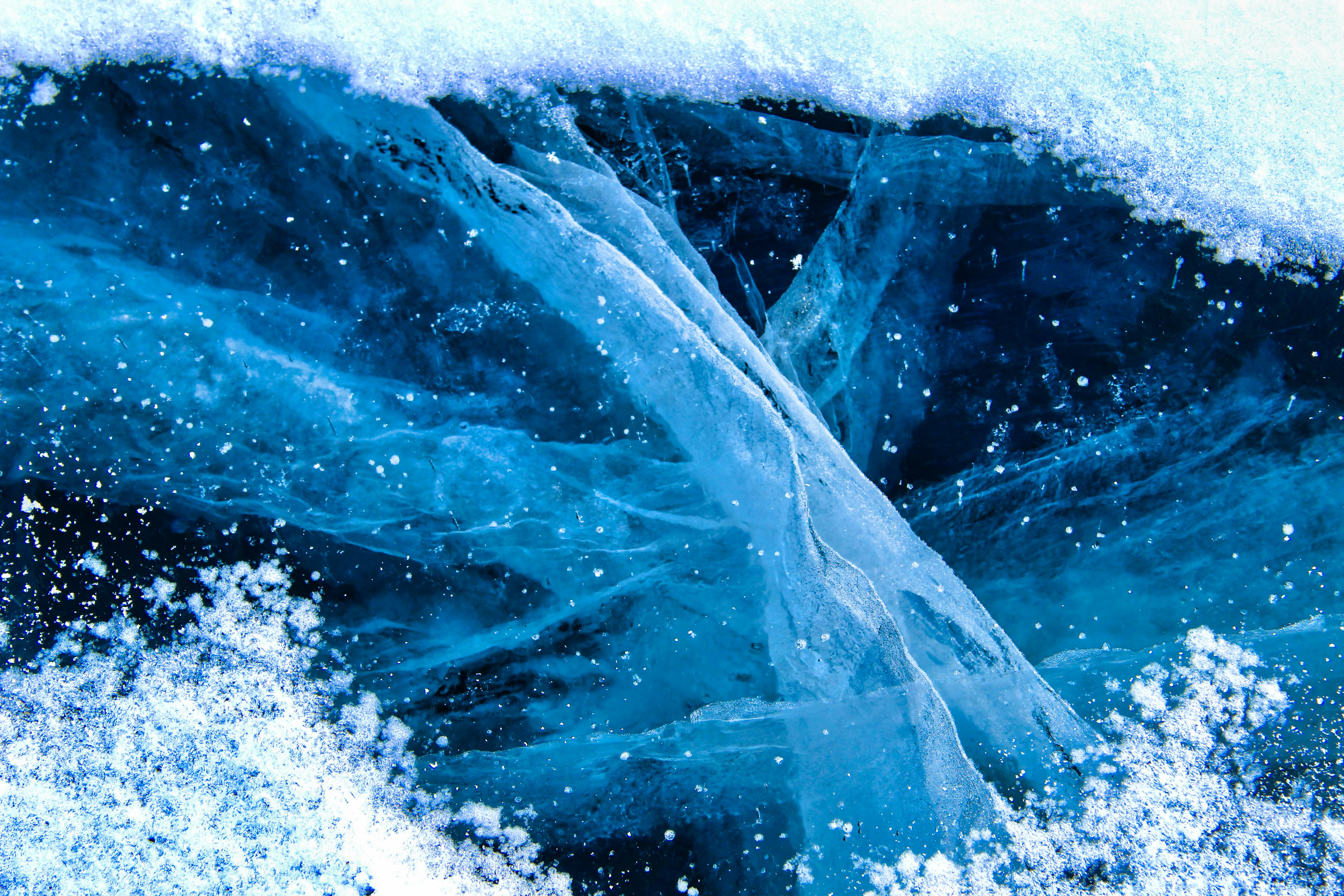 ice and water in the ocean with blue and white ice