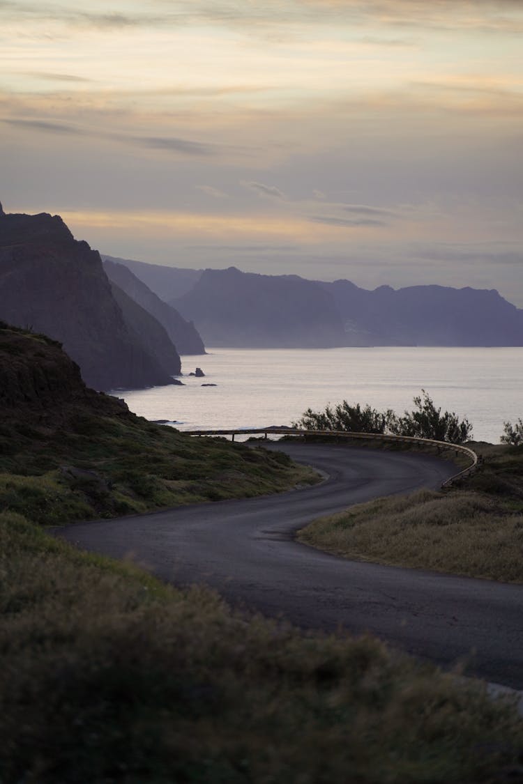 Winding Road By The Seashore At Sunset