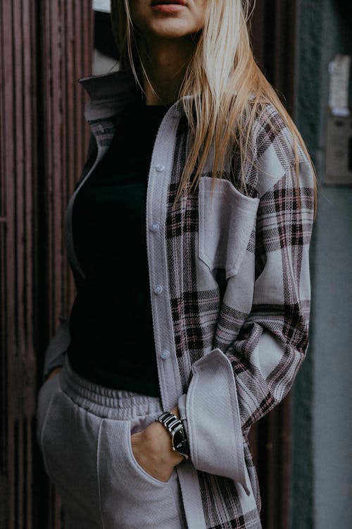 Young Woman Wearing a Casual Outfit with a Checkered Shirt 