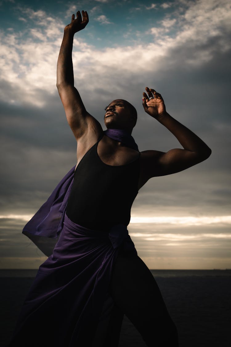 Man Posing With Arms Raised