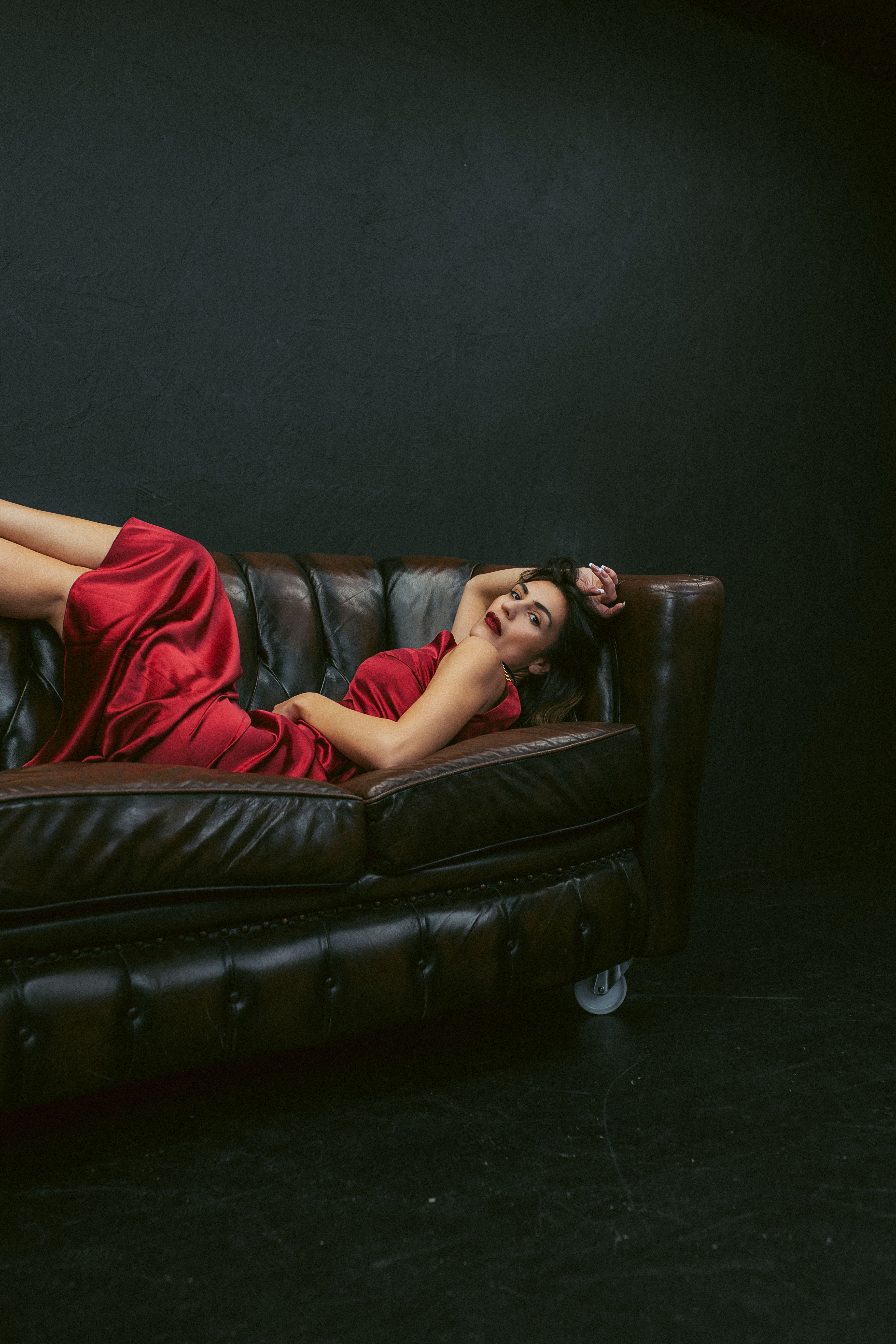 Beautiful Woman in a Black Dress Lying on the Floor · Free Stock Photo