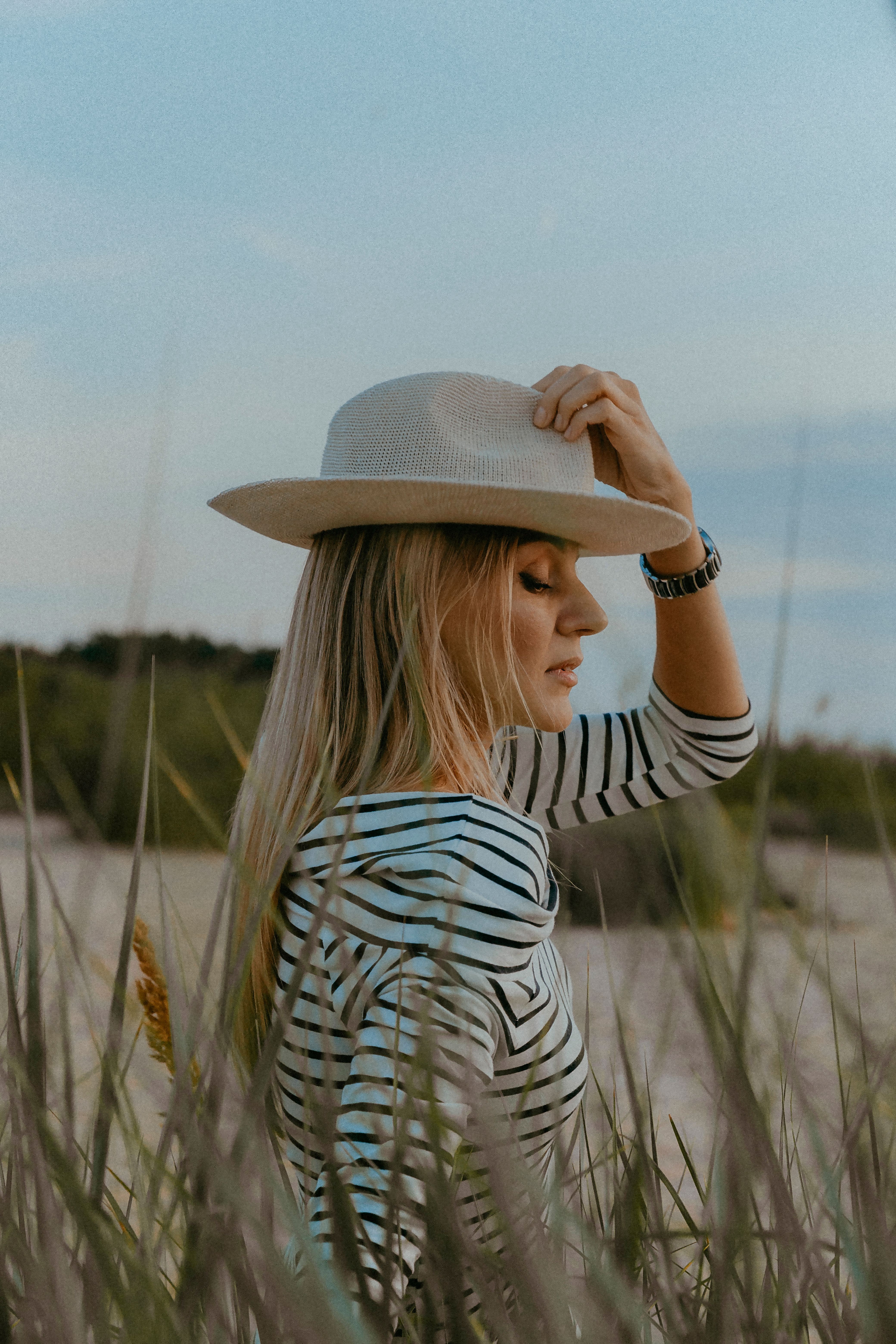 Woman in a Striped Dress and Hat · Free Stock Photo