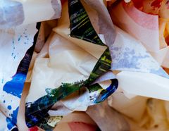 Crumpled paper carrying vivid streaks of paint — photo by Steve A Johnson on Pexels