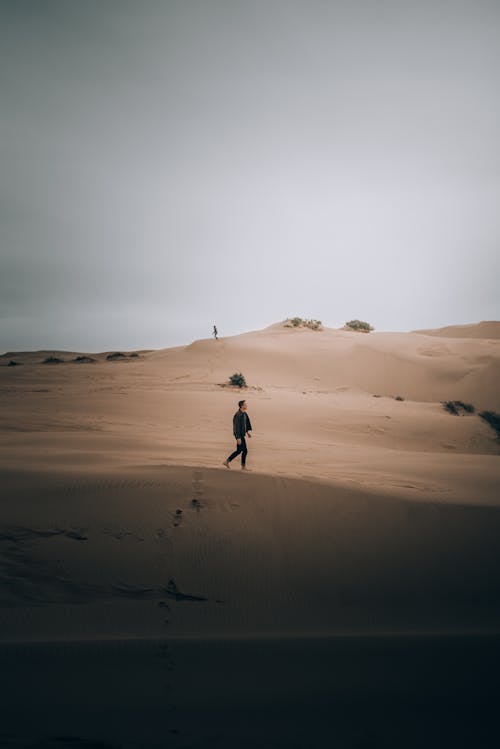 Man Walking on Desert