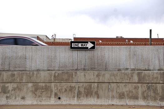 One Way Sign on Wall