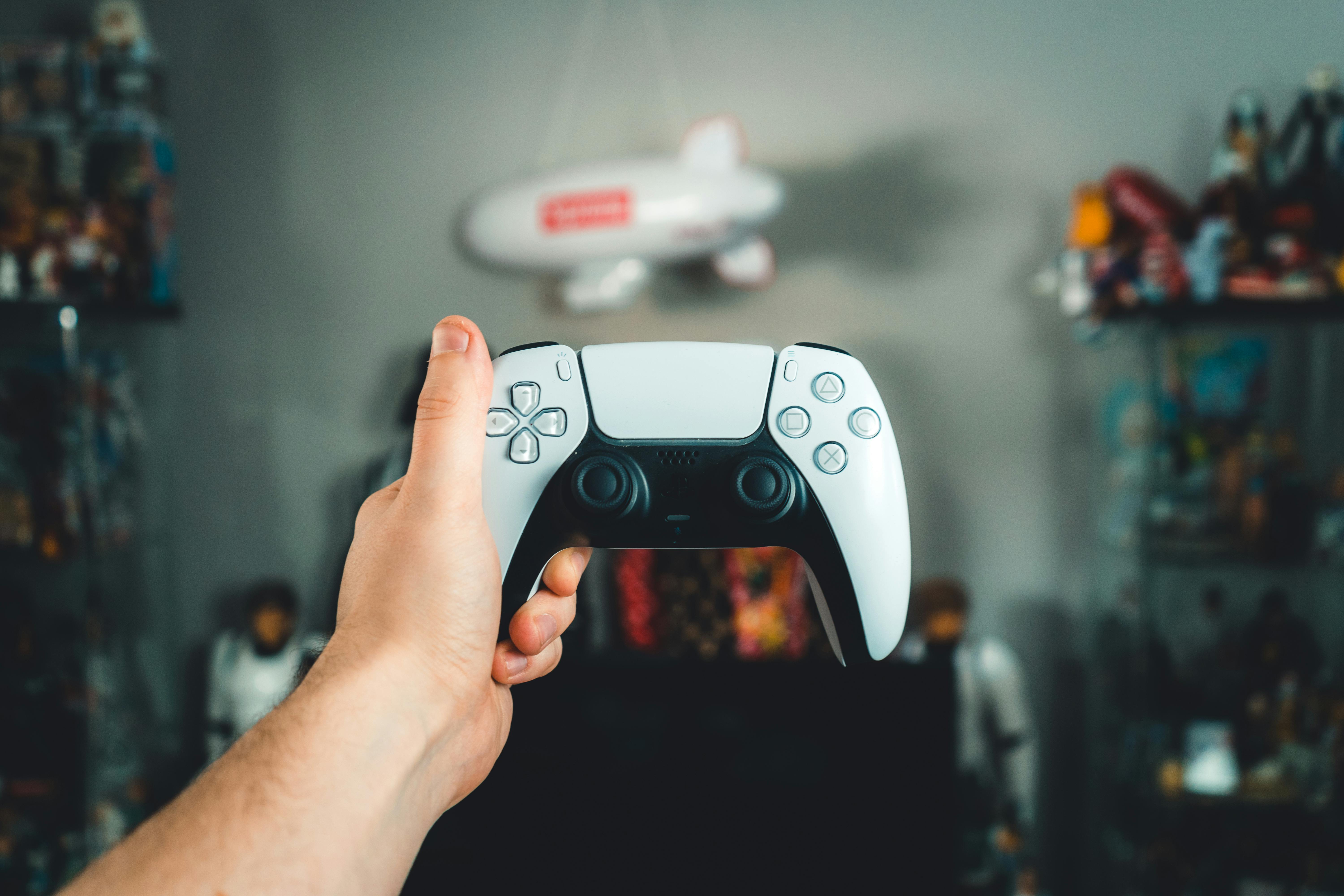 Hand Holding PlayStation Controller · Free Stock Photo