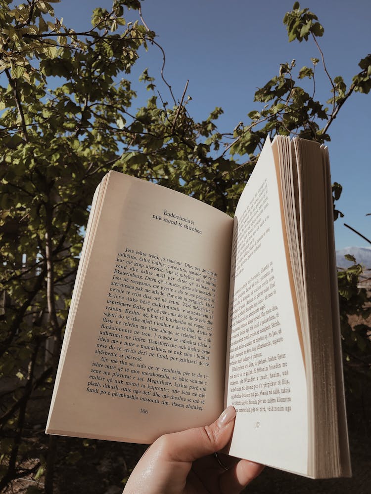 Woman Finger Holding Open Book