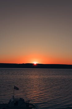 Beautiful sunrise over the ocean with a calm and serene atmosphere, perfect for reflective moments.