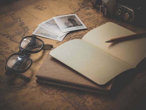 Black Frame Eyeglasses Beside Open Book