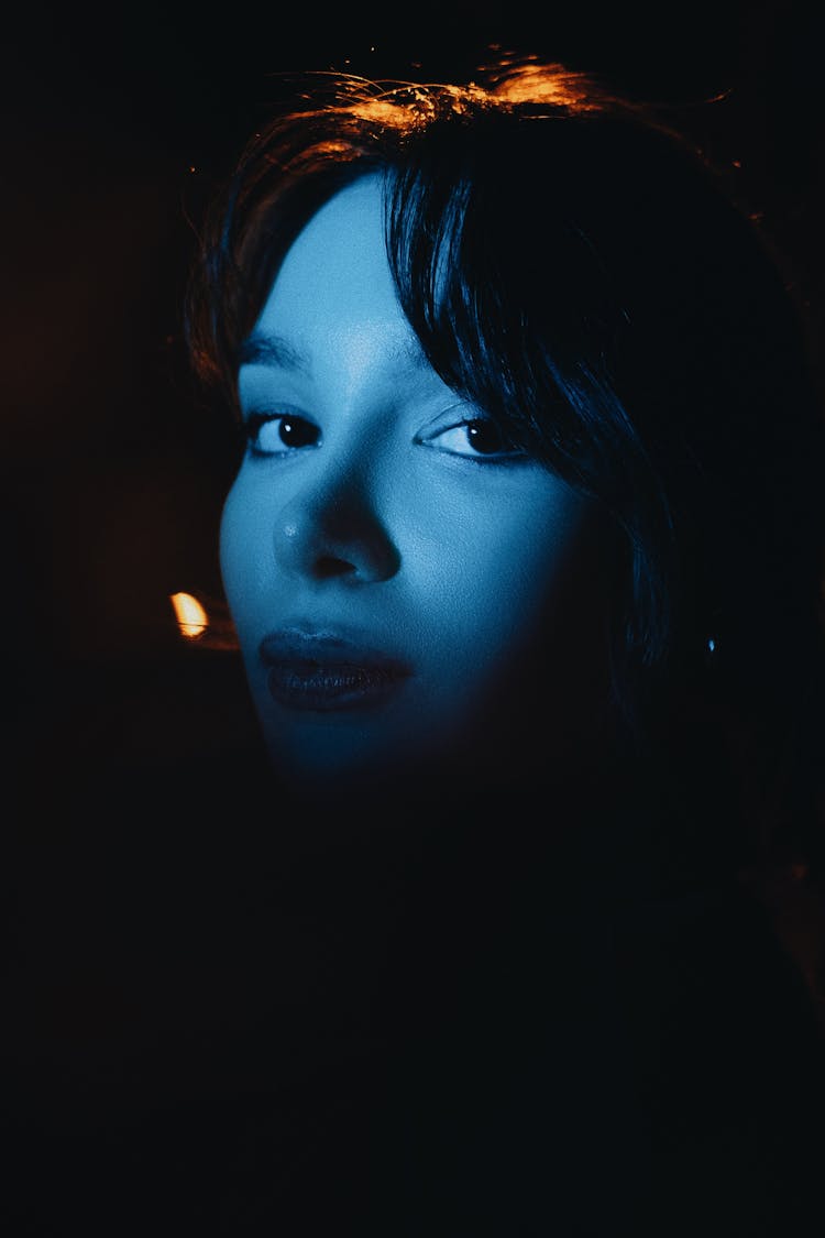 Woman Face In Darkness