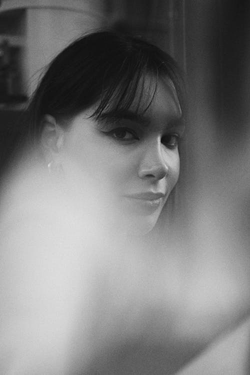 Black and White Photo of a Smiling Woman 