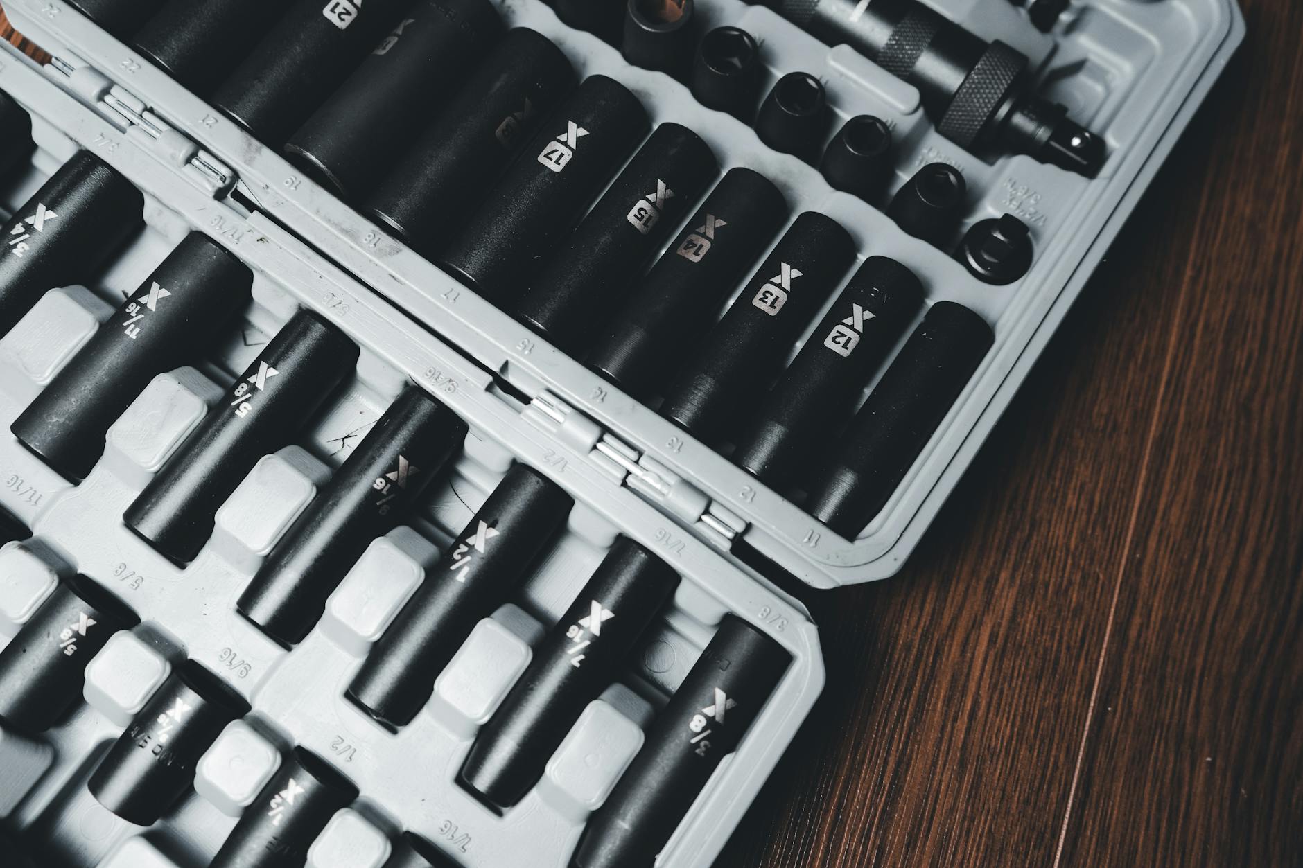 A detailed close-up of a socket tool set neatly arranged in a hard case, ideal for mechanical work.